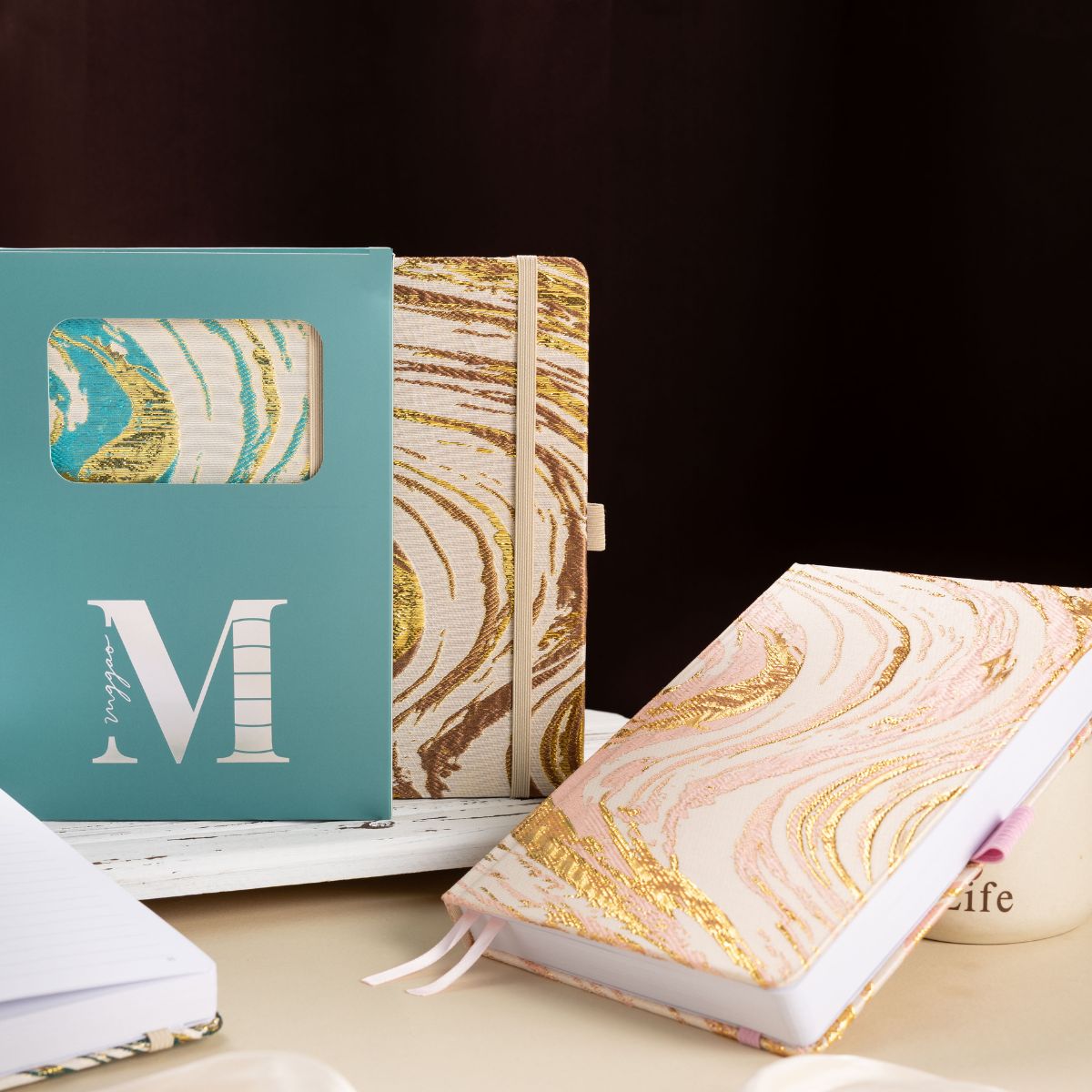 A5 premium fabric notebook placed next to its signature light blue window-cut gift box, ready for gifting to writers and students.