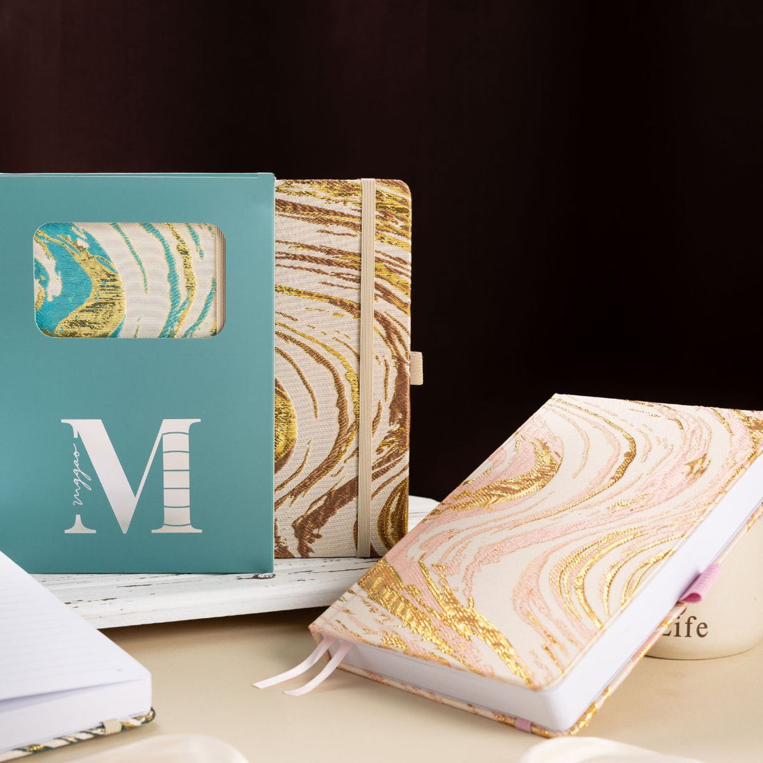 A5 premium fabric notebook placed next to its signature light blue window-cut gift box, ready for gifting to writers and students.