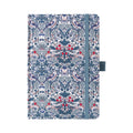 A5 blue ornamental floral fabric notebook standing upright on a white background with a matching blue elastic closure, featuring an intricate symmetrical botanical pattern with red and white accents.