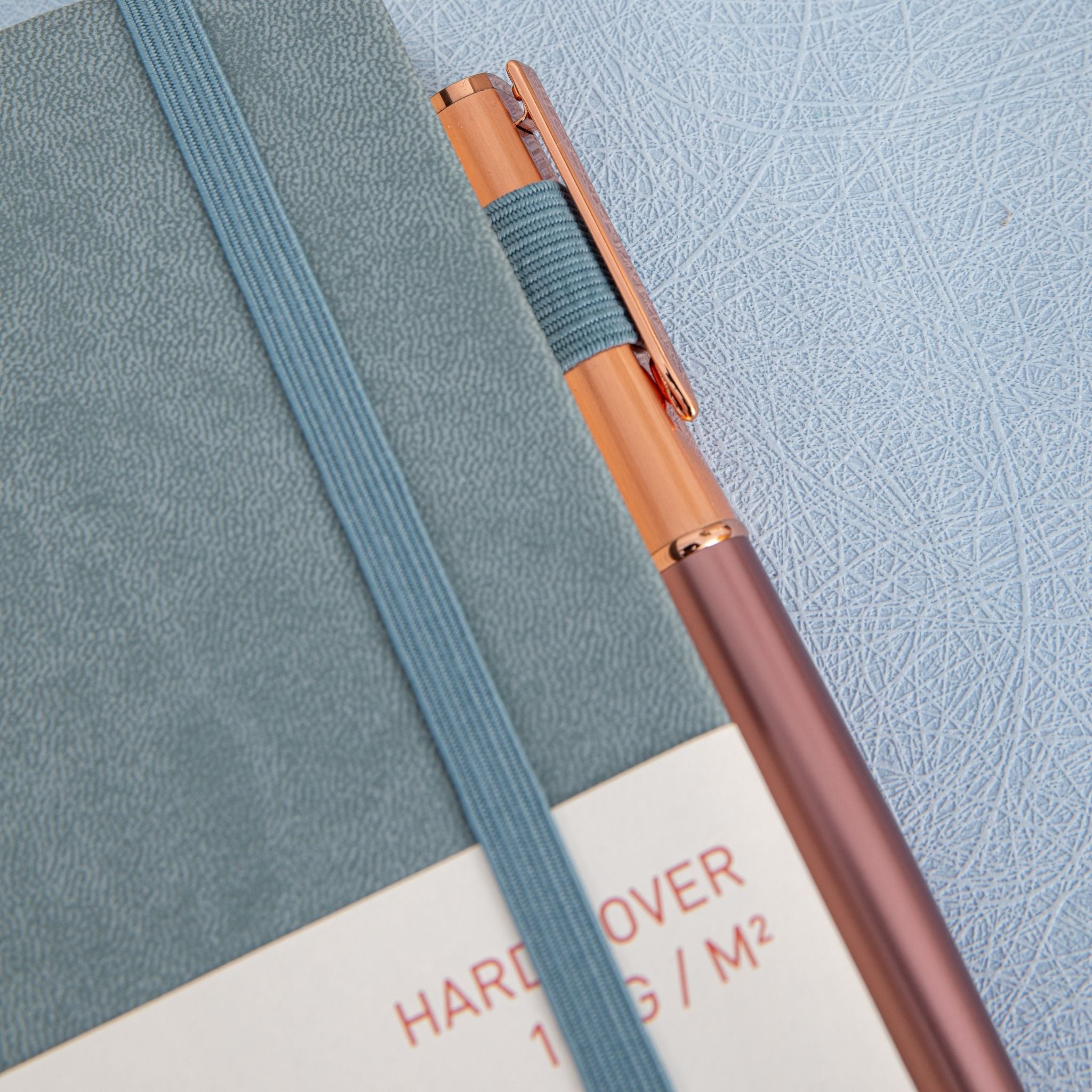 MGGAO A5 Grey Vegan Leather Notebook Close-up, Pen and Packaging Sleeve Detail