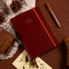 A5 Brown Vegan Leather Hummingbird Notebook on Desk with Wooden Pen and Vintage Mat