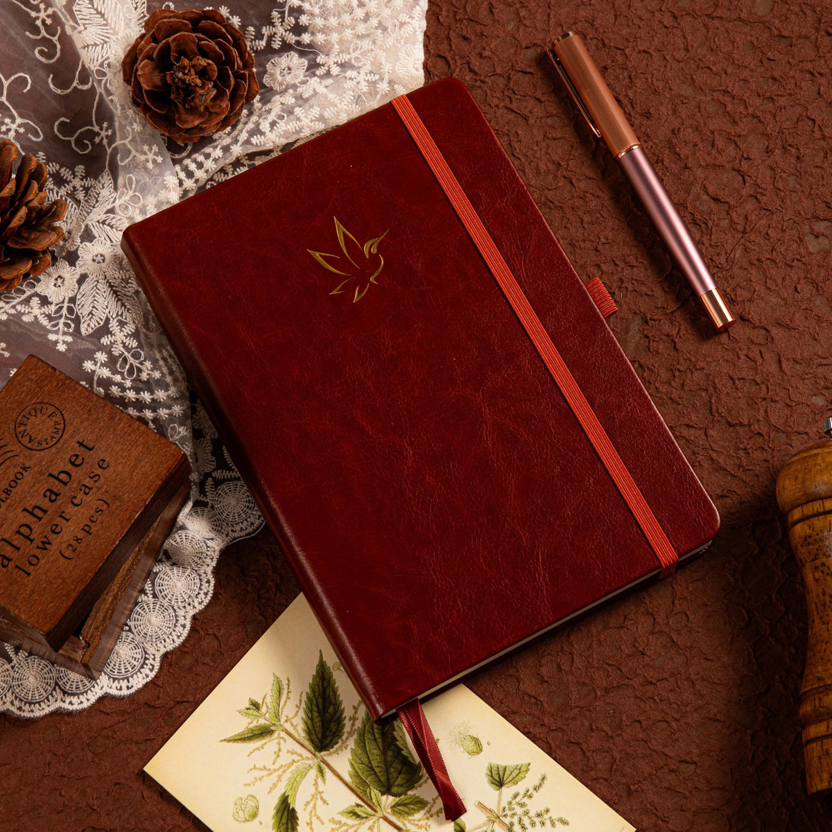 A5 Brown Vegan Leather Hummingbird Notebook on Desk with Wooden Pen and Vintage Mat