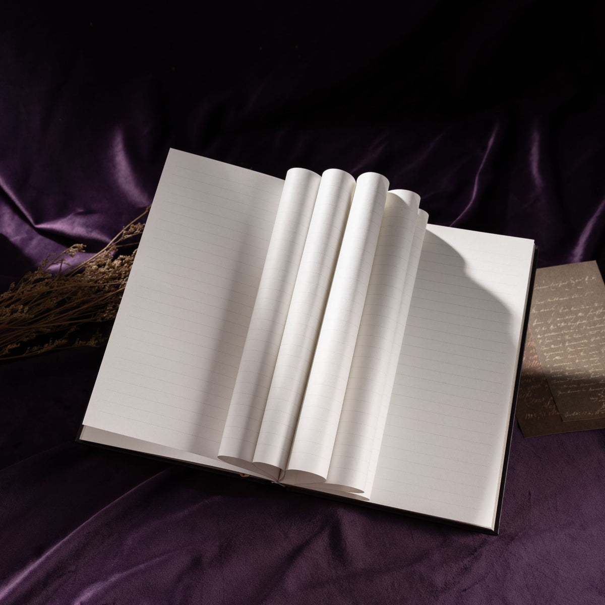 A5 Dark Purple Taupe Floral Tapestry Hardcover Notebook Open, Fanned Pages Showing 100gsm Thick Paper on Purple Silk