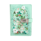 A5 green vegan leather journalwith a floral arch design and a 3-digit metal combination lock, standing upright on a white background with a matching mint green elastic band.
