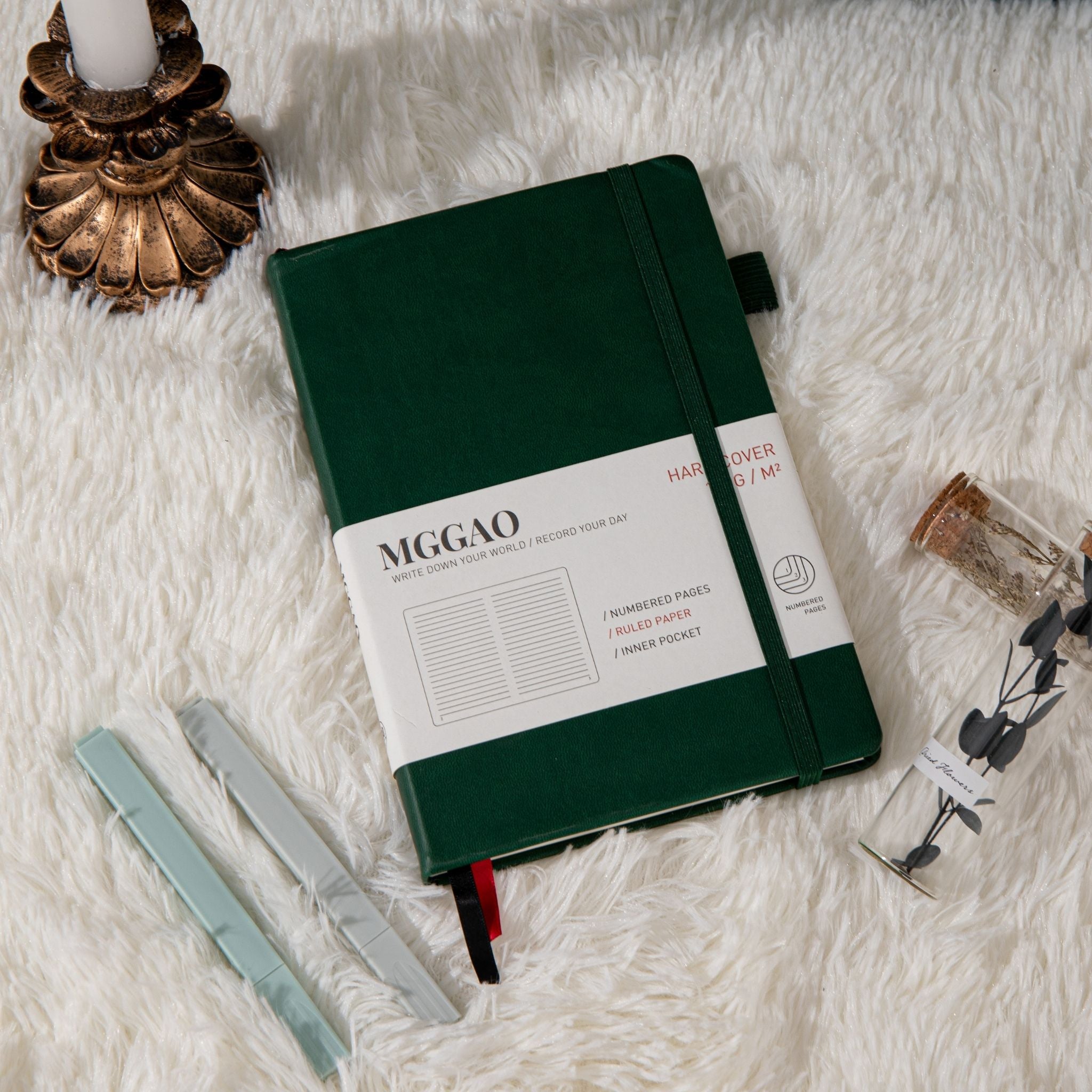 MGGAO A5 Green Vegan Leather Notebook Close-up, Pen and Packaging Sleeve Detail