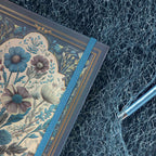 A5 Indigo Blue Floral Cameo Hardcover Notebook Close-up, Elastic Closure Band with Gold Detailing and Pen