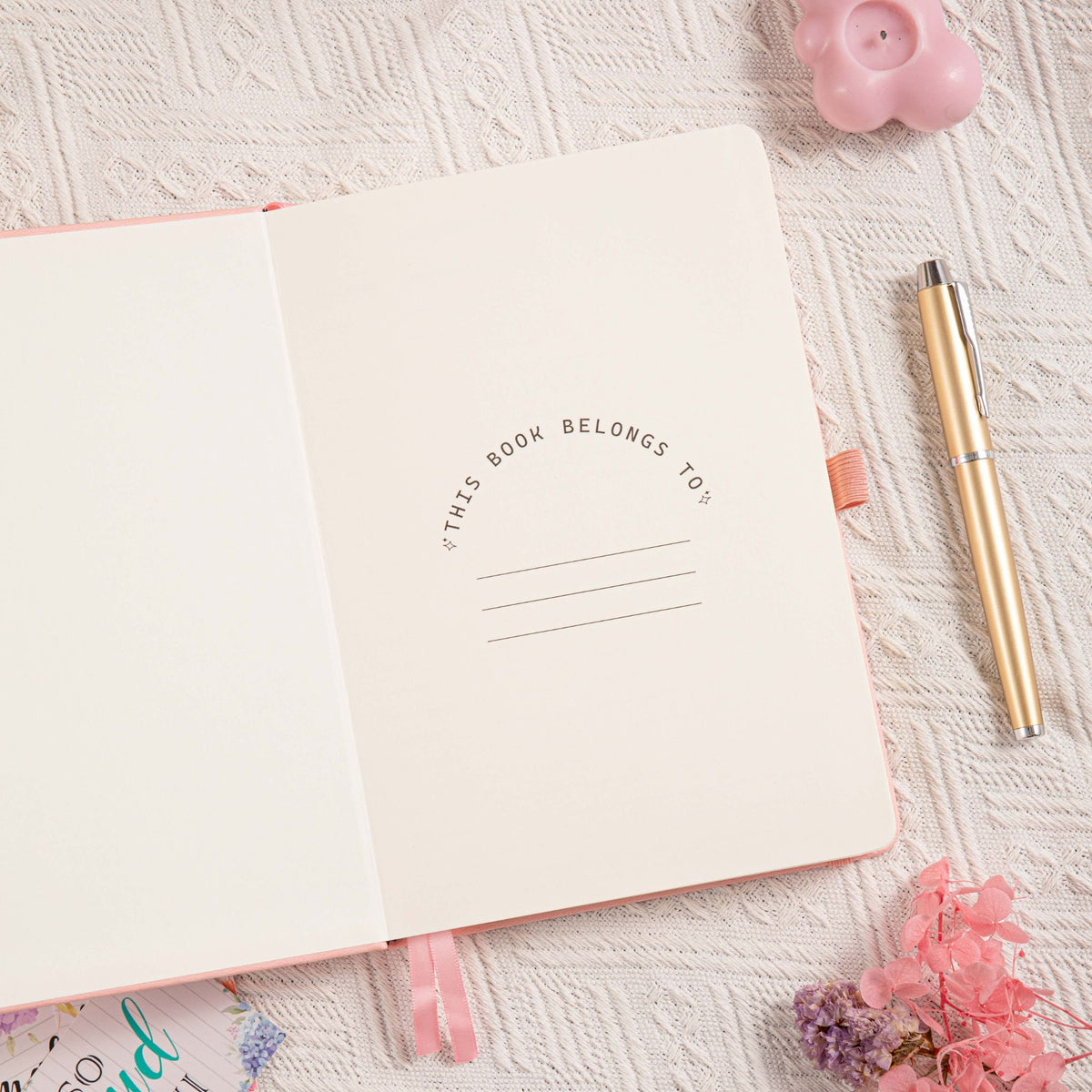 A5 Pink Vegan Leather Hummingbird Notebook, Personal Information Page with Pen on Desk