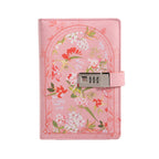 A5 pink vegan leather journal with a floral arch design and a 3-digit metal combination lock, standing upright on a white background with a matching pink elastic band.