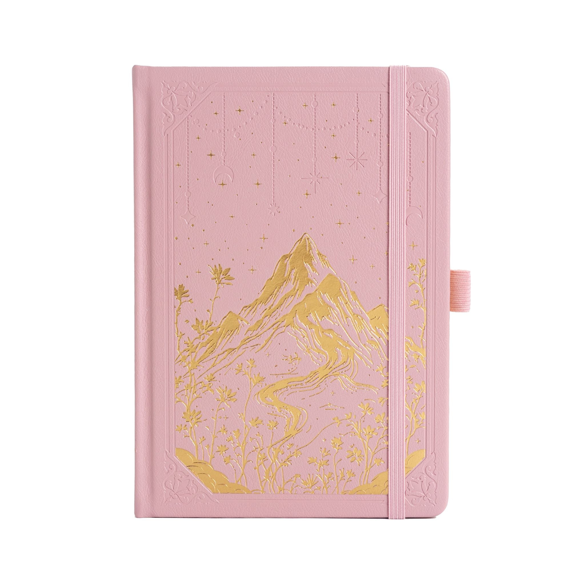 A5 pink vegan leather notebook with gold foil mountain and starry night embossing, standing upright on a white background with a matching pink elastic band.