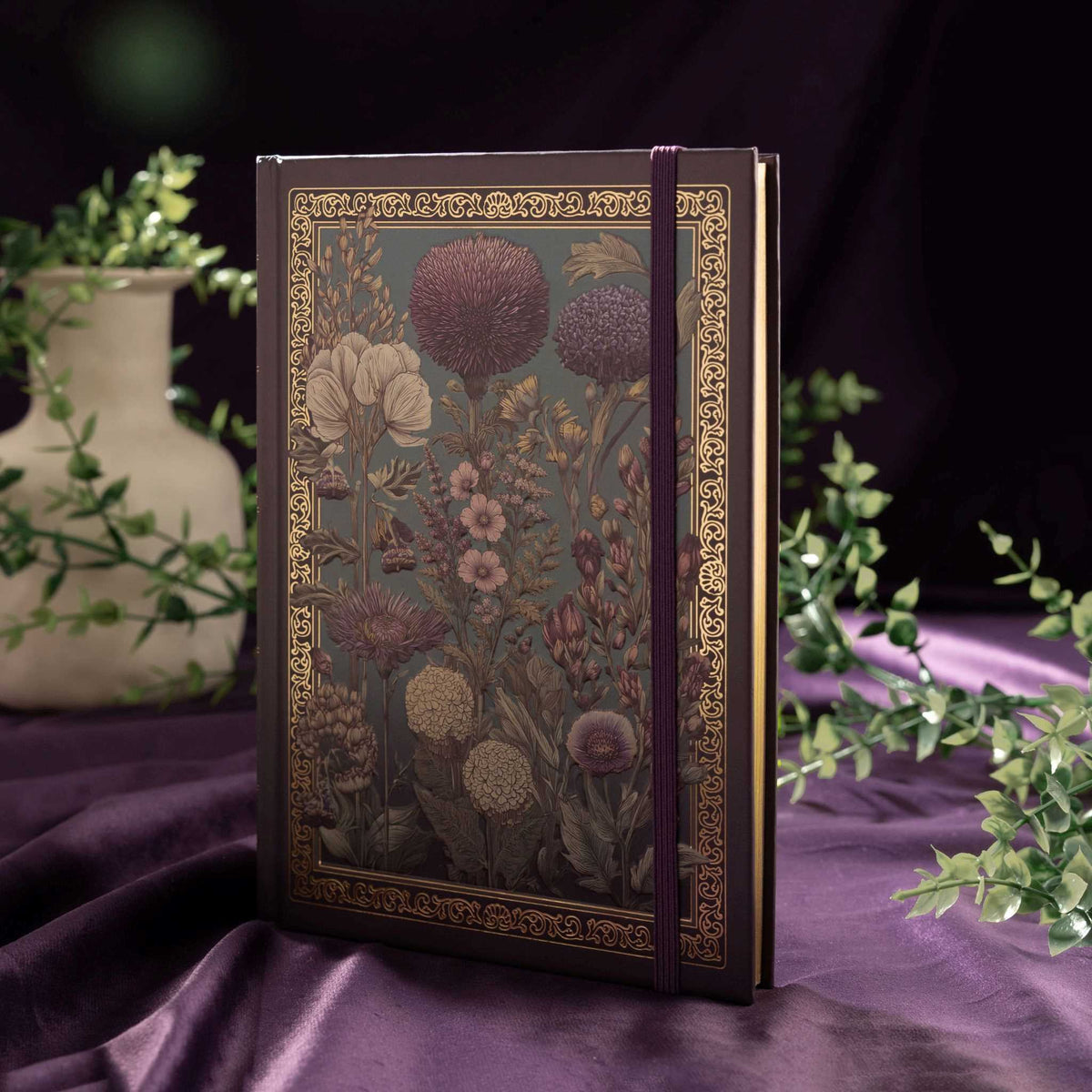 A5 Purple Taupe Floral Tapestry Hardcover Notebook Standing on Purple Silk, Elastic Closure with Green Plants Background