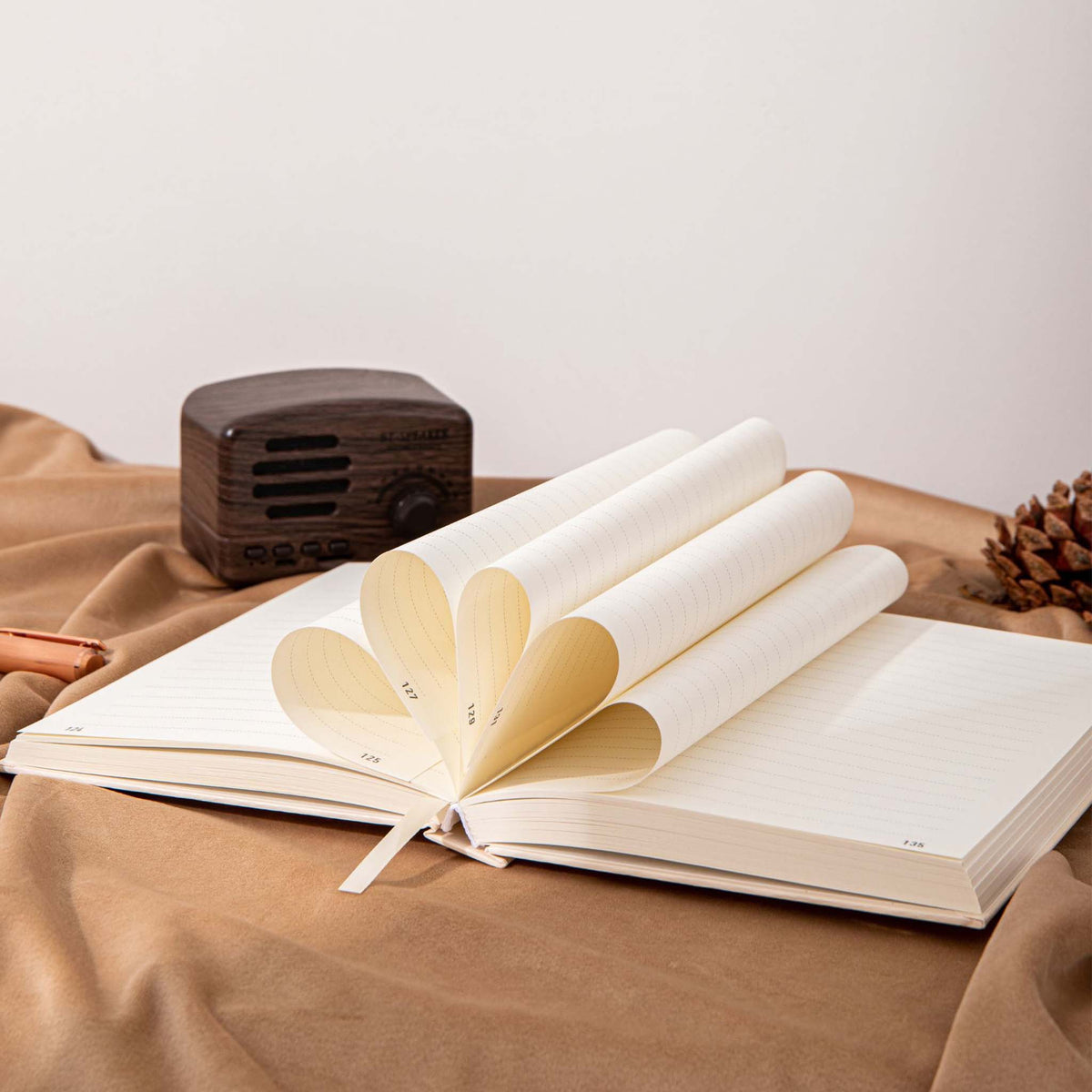 A5 Wind Flowers Hardcover Lined Notebook Fanned Pages, 320 Pages 100gsm Thick Paper on Wooden Desk