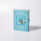 B6 Light Blue Rose Embossed Vegan Leather Journal with Gold Heart Lock, White Background Side View