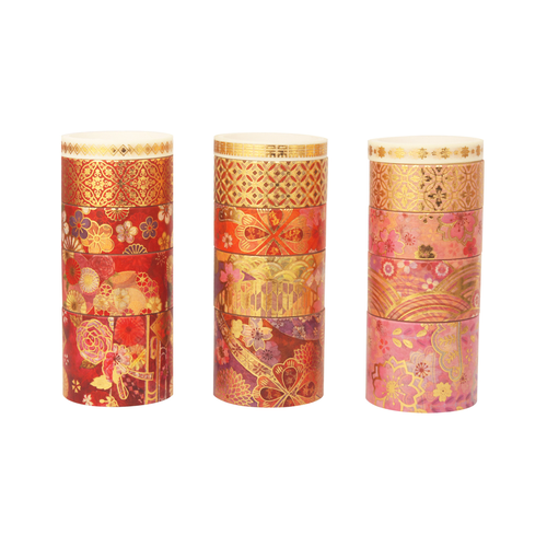 Three rolls of blossom gold foil washi tape in varying widths and pink, red, and gold floral patterns, standing upright on a white background.