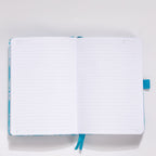 Open A5 notebook showing the lined paper interior with light blue ribbon bookmark