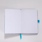 Open A5 journal showing the dot grid interior pages