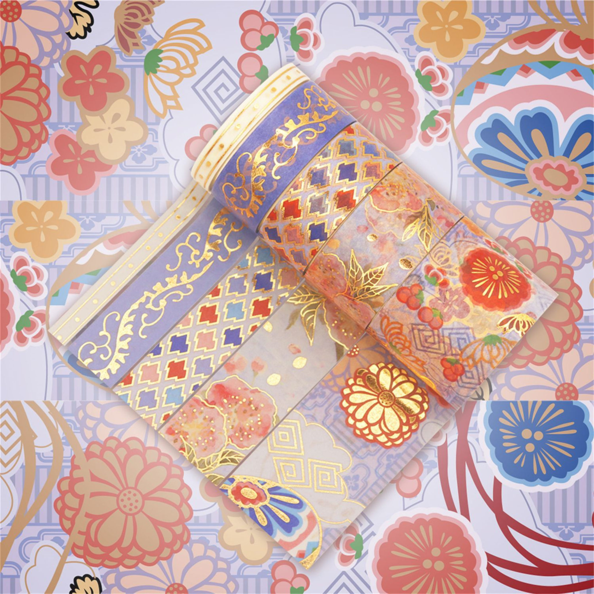 Purple and gold brocade washi tape rolls laid out flat, featuring traditional floral rosettes and geometric lattice motifs with a gold foil finish.