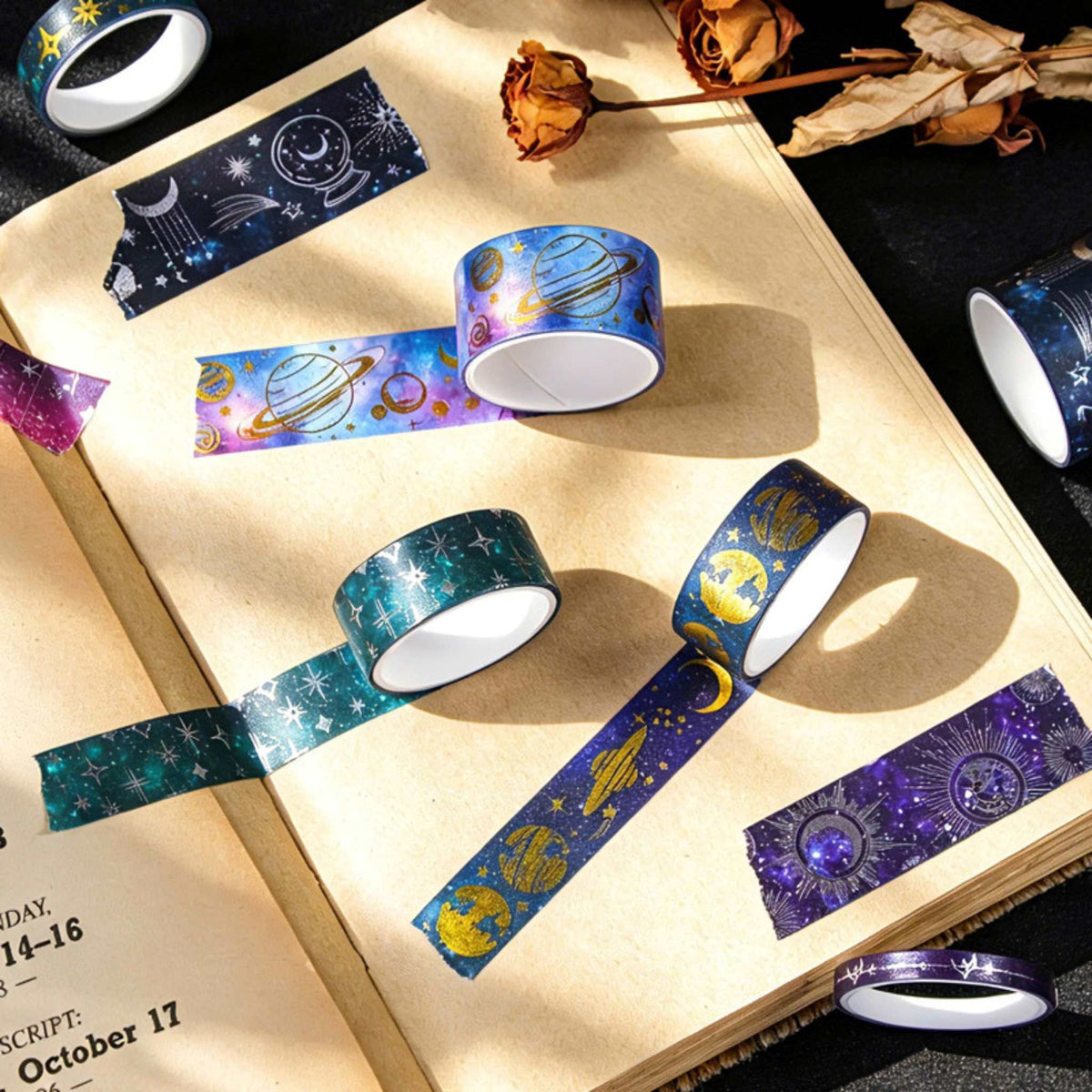 Celestial Dream Foil Washi Tape Set 19 Rolls, Loose Rolls and Unrolled Tapes on Wooden Desk with Scissors