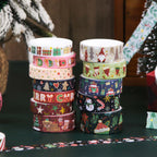 Christmas Gold Foil Washi Tape Set 12 Rolls, Stacked Rolls on Dark Green Table with Christmas Tree Background