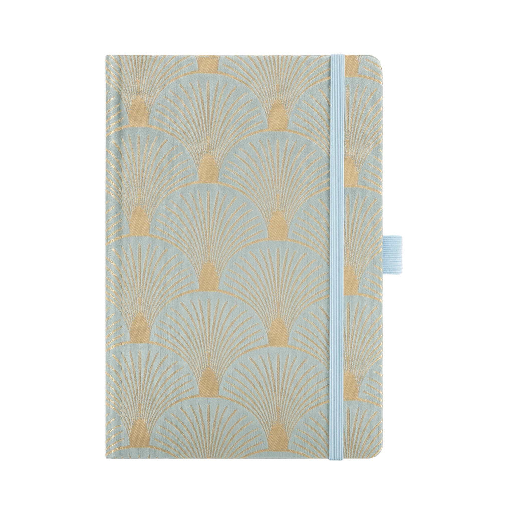 A5 woven fabric notebook with a scalloped embroidery pattern in light green and gold, standing upright on a white background with a matching light blue elastic band.