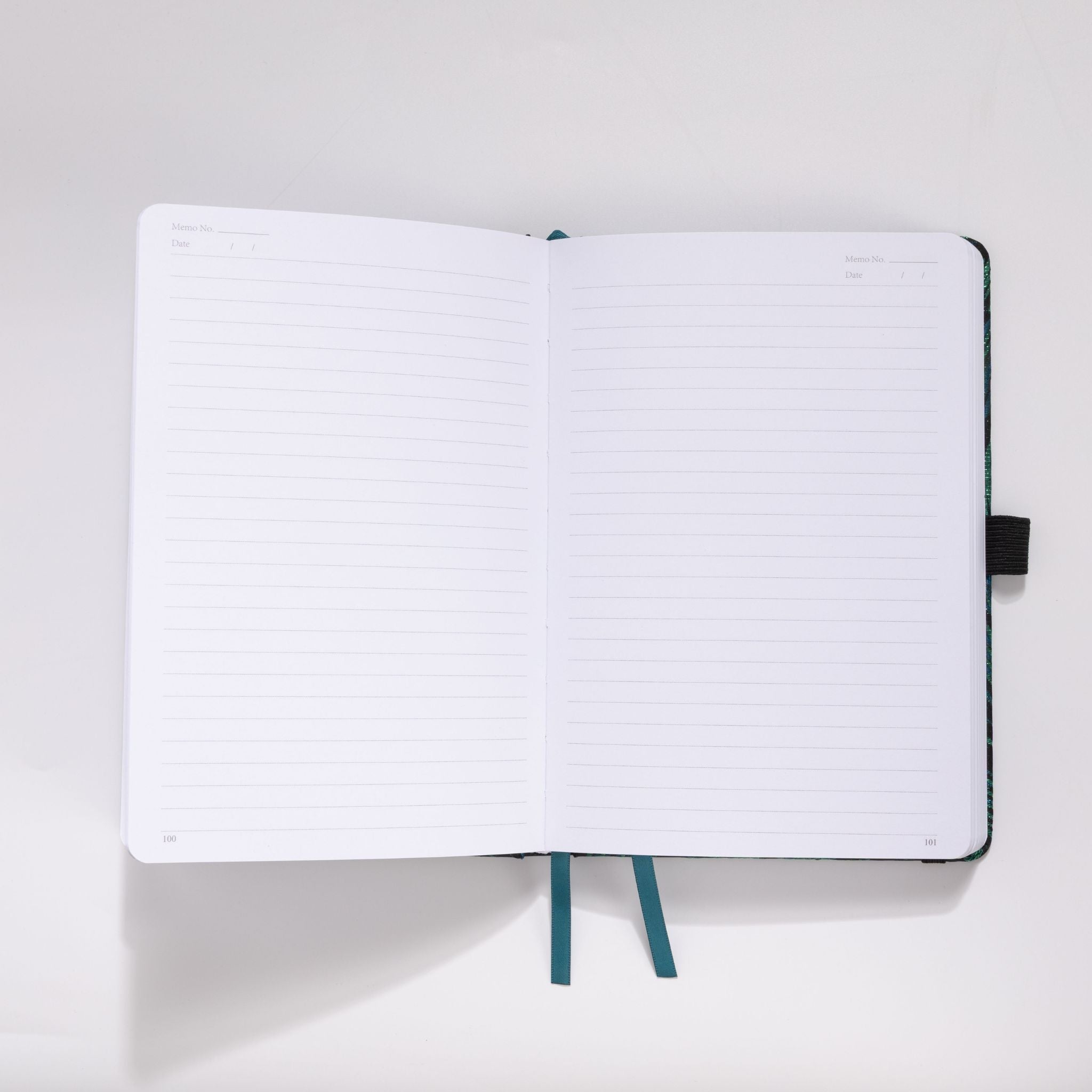 Open A5 notebook showing the 100gsm lined paper interior with date headers