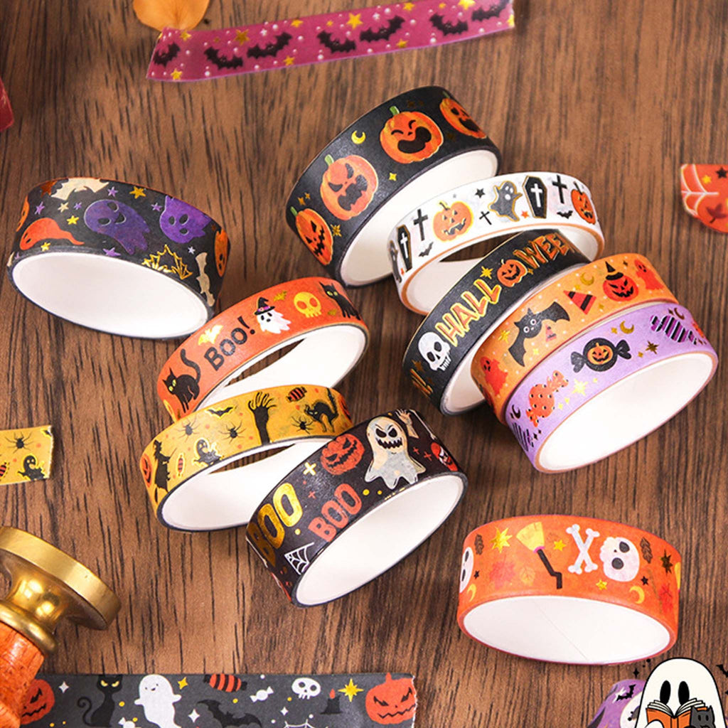 Halloween Gold Foil Washi Tape Set 12 Rolls, Loose Rolls on Wooden Desk Showing Pumpkin, Ghost, Bat and Skull Patterns