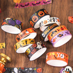 Halloween Gold Foil Washi Tape Set 12 Rolls, Loose Rolls on Wooden Desk Showing Pumpkin, Ghost, Bat and Skull Patterns