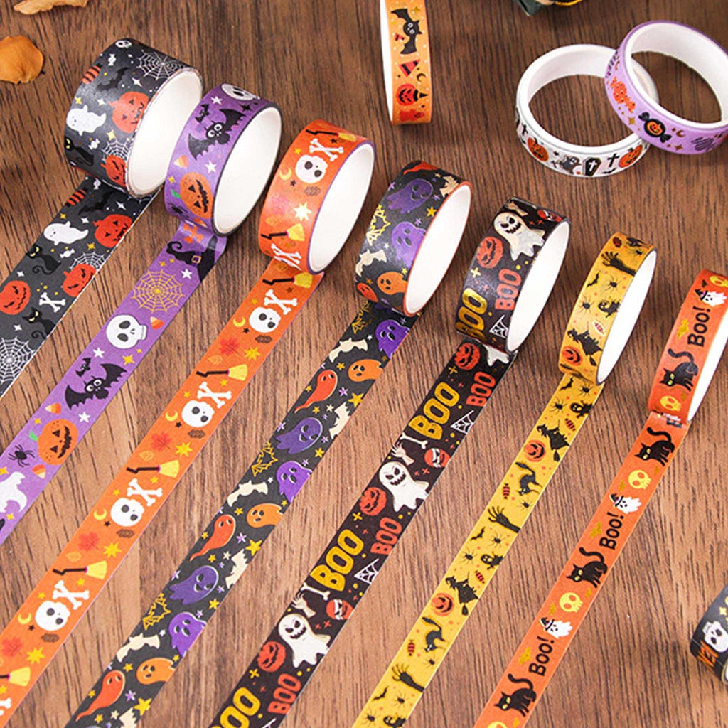 Halloween Gold Foil Washi Tape Set 12 Rolls, Assorted Rolls Fanned Out on Wooden Desk Showing Mixed Widths and Spooky Patterns