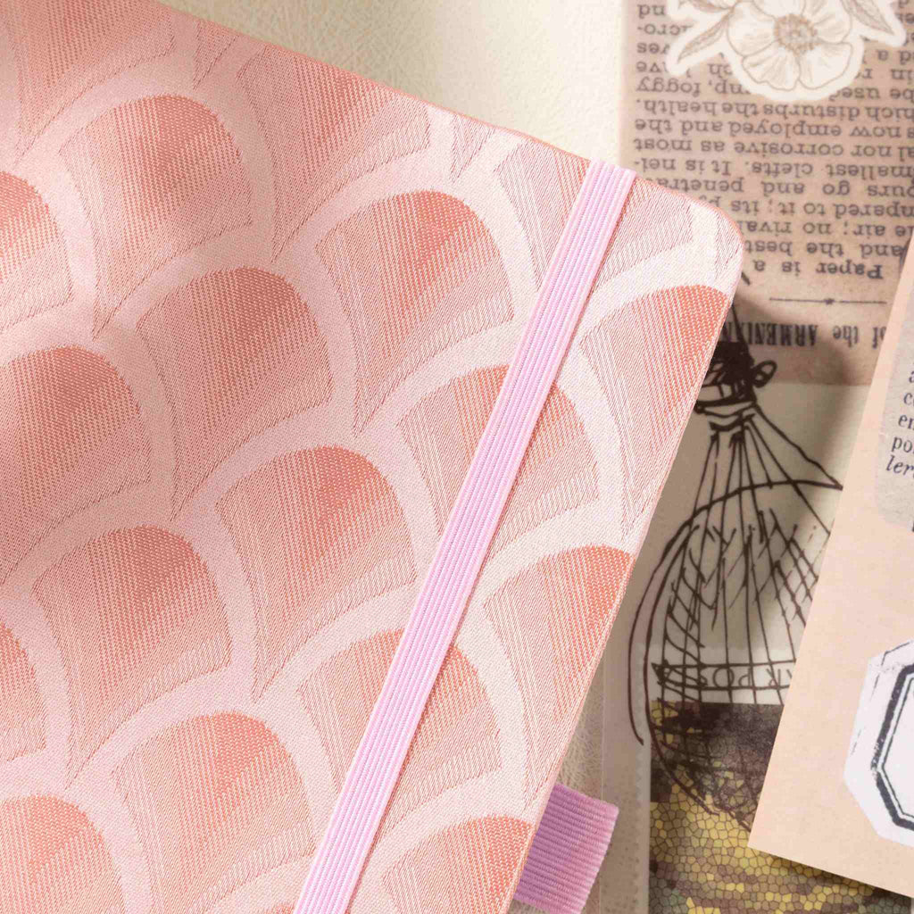 A5 pink scalloped fabric notebook styled on desk – lifestyle shot