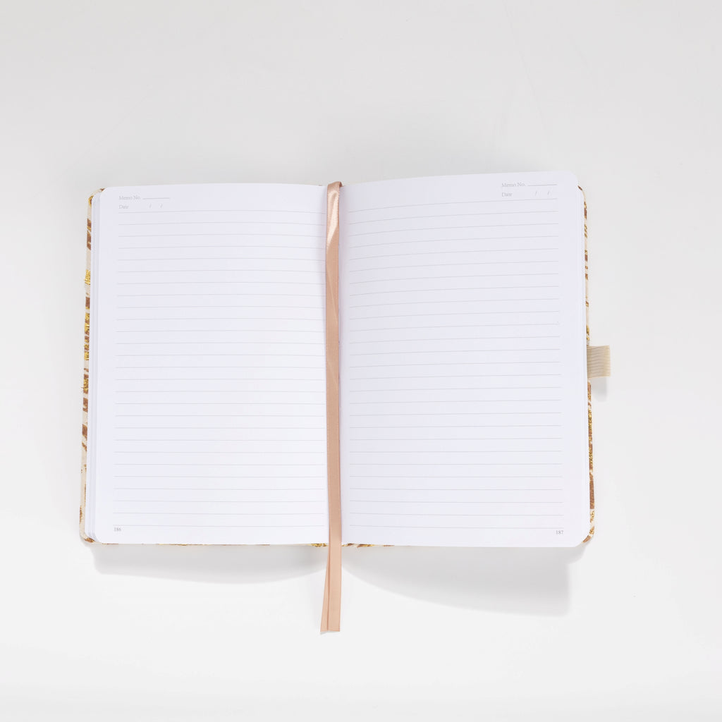 100gsm lined pages with month and date header in gold marble notebook