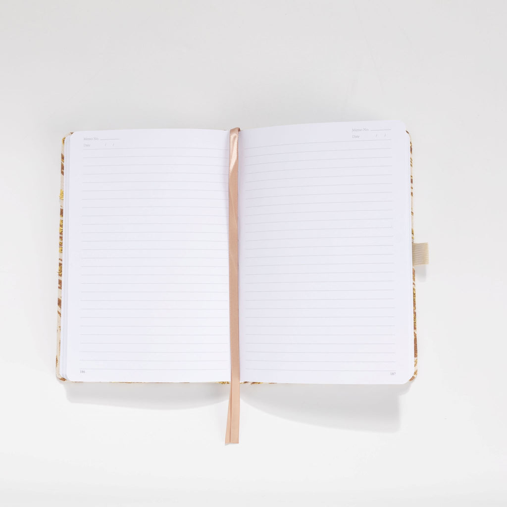 100gsm lined pages with month and date header in gold marble notebook