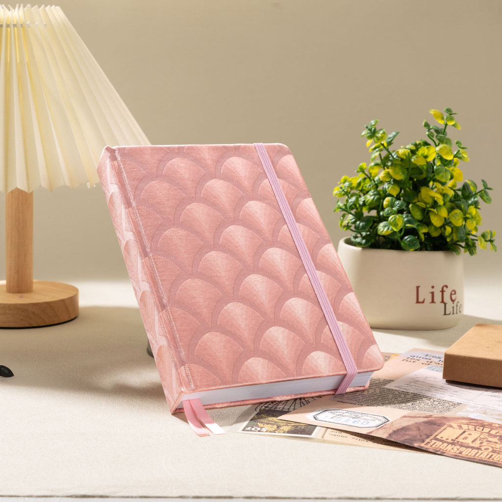 A5 pink scalloped fabric notebook styled on desk – lifestyle shot