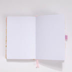 Open A5 journal showing the thick 160gsm dot grid interior pages