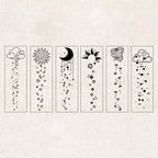 A flat-lay of 6 stamped line-art designs from the Rain Sleep Notes set, each featuring a vertical layout of rain clouds, sun with leaves, moon and stars, sunburst, wind swirl, and rain clouds with dots, displayed on a textured background.