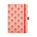 A5 red woven fabric notebook with a scalloped embroidery pattern, standing upright on a white background with a matching red elastic band.