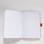 Open A5 notebook showing the 100gsm lined paper interior with date headers