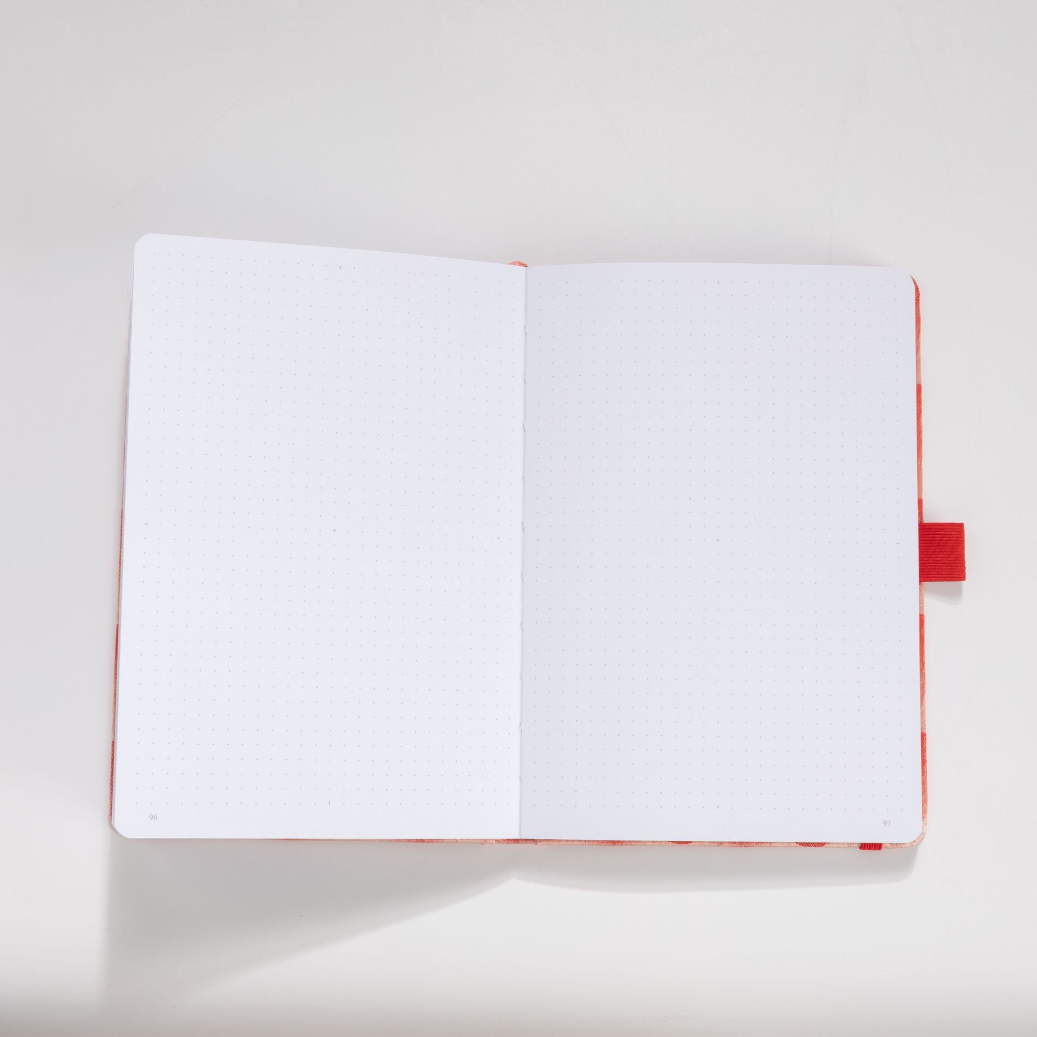 Open A5 journal showing the 160gsm dot grid interior pages, thick and bleed-resistant