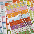 Collection of colorful planner stickers with various designs on a white background.